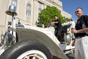 John Vasquez and Raymond Melton admire a 1910 Oklahoma City fire engine parked in front of City Hall for the city's 25th birthday celebration. (Oklahoma Gazette / file)